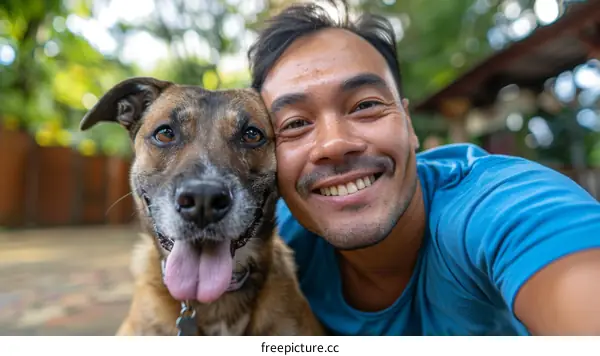 A man and his dog take a selfie together