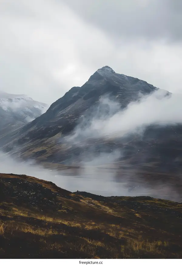 Misty Mountain Landscape With Cloudy Sky
