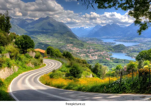 Mountain Road Winding Through Green Landscape