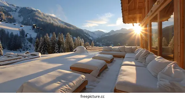 Modern house exterior with terrace and amazing mountain view in winter