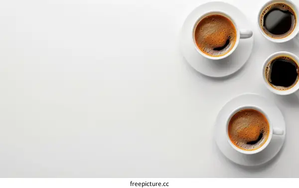 Three White Coffee Cups on White Background
