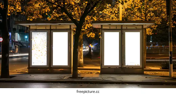 Blank Billboard Advertisement Sign On City Street At Night
