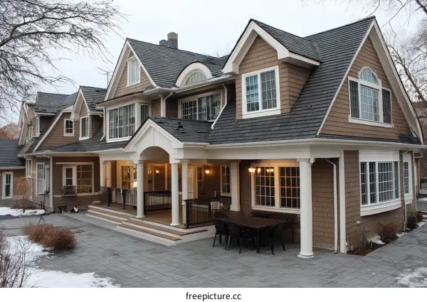 Elegant House Exterior with Covered Patio in Winter
