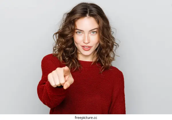 Woman in Red Sweater Pointing