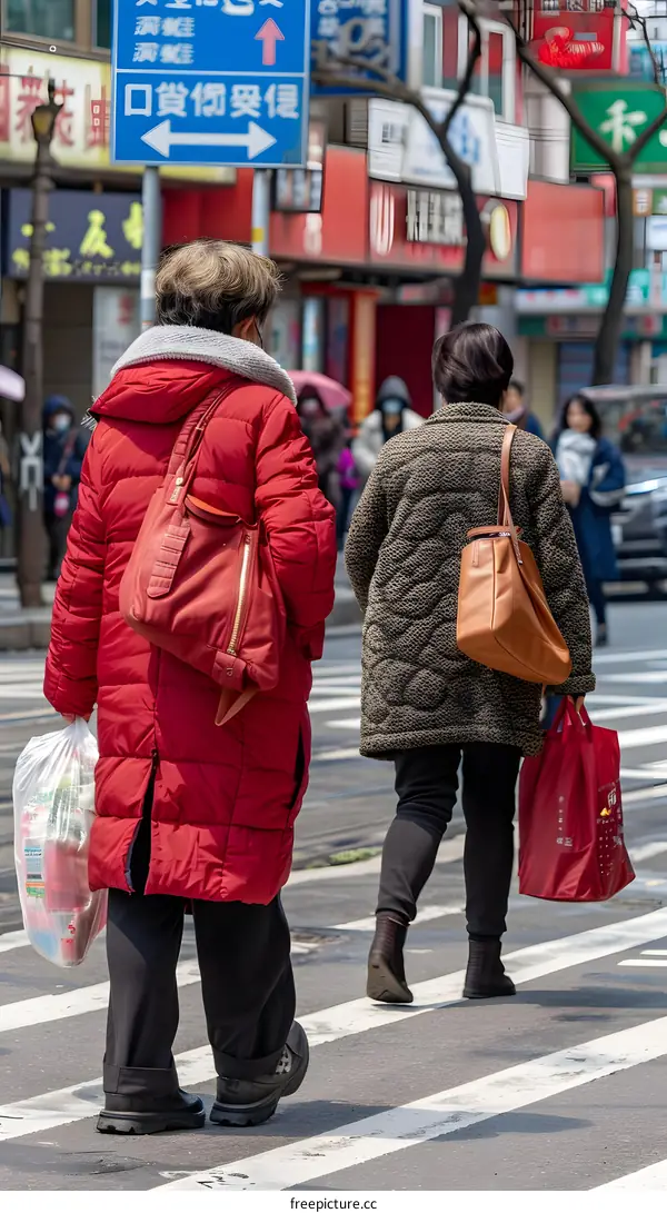 Two Women Walking on a Crosswalk in China