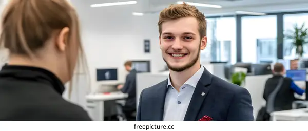 Smiling Businessman in Office Setting