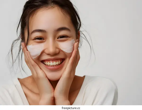 Smiling Asian Woman with White Mask on her Face