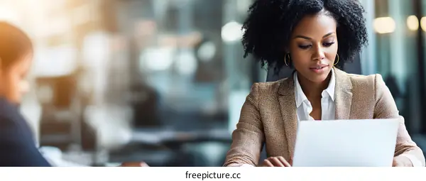 African American Business Woman Working on Laptop Computer in Office