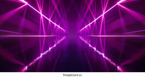 Pink laser light show in a dark room