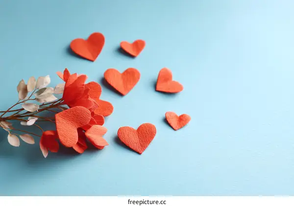 Red Paper Hearts Bouquet on Light Blue Background