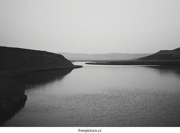 Black and white landscape of a river through a valley