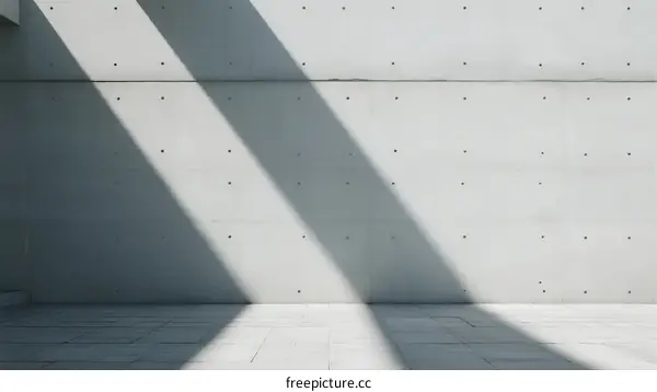 Concrete Wall with Sunlight Shadows and Geometric Patterns