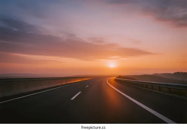 Sunrise over an empty highway with beautiful sky