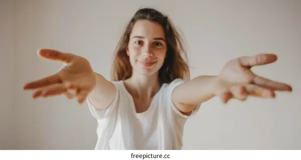 Young woman with open arms