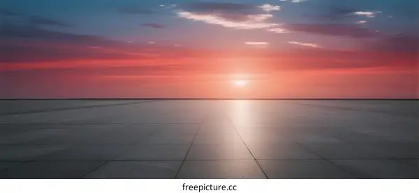 Beautiful sunset over a smooth, empty surface with vibrant colors
