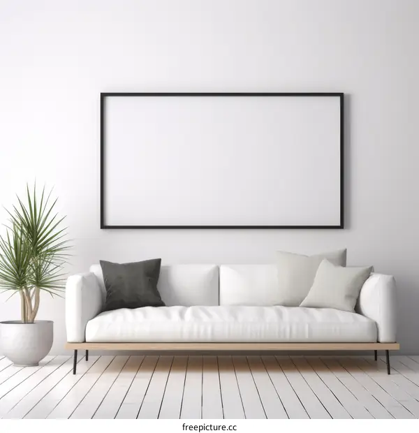 White sofa and plant in front of a blank wall