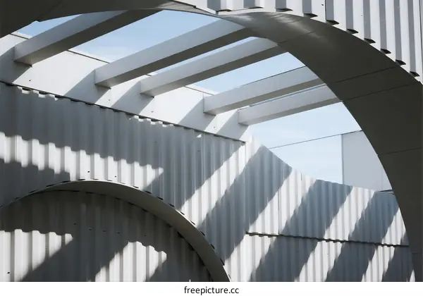 Modern Architectural Design with Curved Arches and Metallic Structure