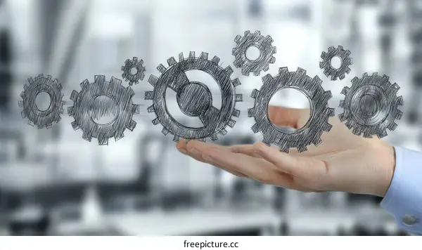 Hand Holding Gears Illustration of Teamwork and Efficiency