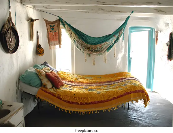 White Walls and Yellow Bedspread in a Rustic Bedroom