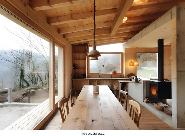 Wooden Cabin Interior with Large Window and Fireplace