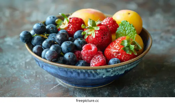 Blueberries, strawberries, and raspberries in a bowl