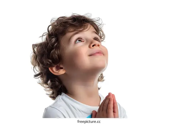 Young Boy Praying With Hands Together Looking Upwards