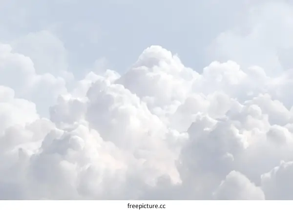 Fluffy Clouds Against a Light Blue Sky