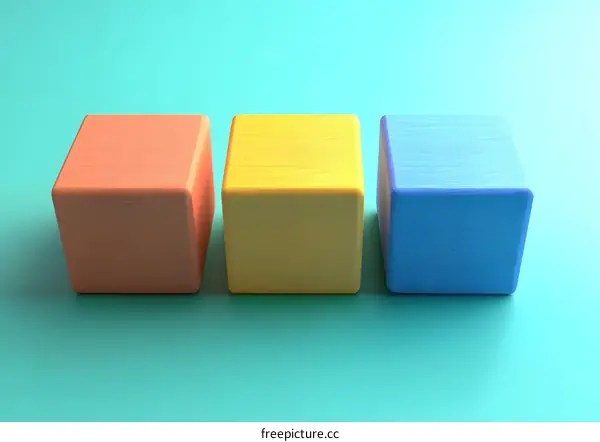 Three Colorful Cubes on a Turquoise Background