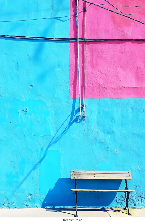 Blue and Pink Wall with Wooden Bench