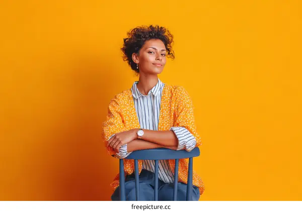 Stylish African American Woman Sitting on Chair