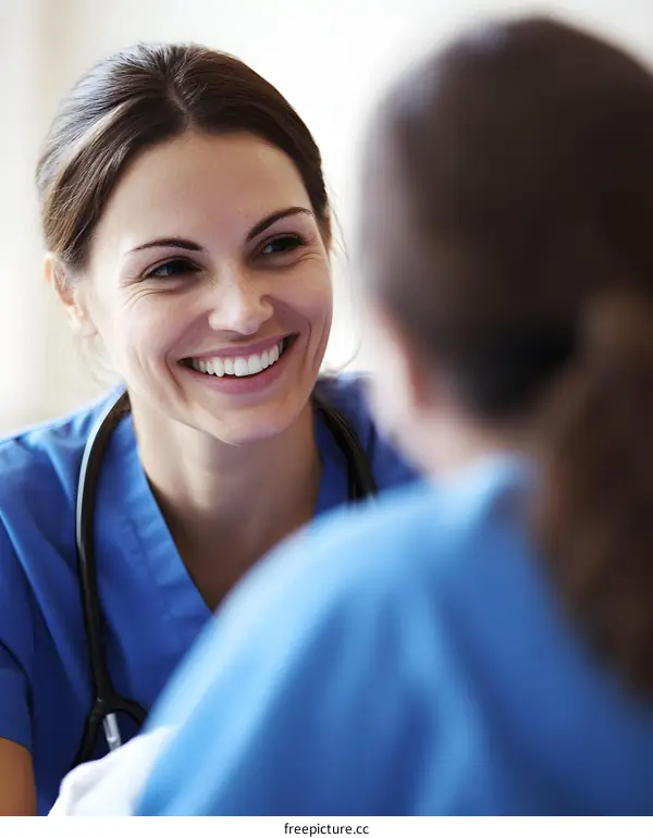 Smiling Female Doctor Talking With Patient