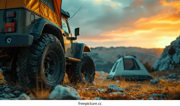 Sunset Camp with Jeep and Tent in the Mountains