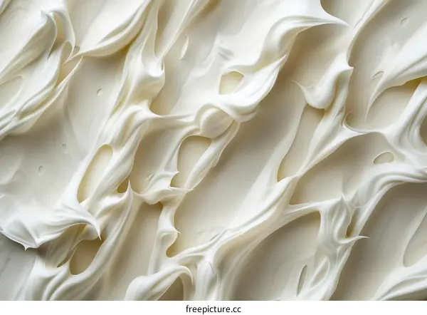 Close-up of white creamy thick substance with a smooth and silky texture
