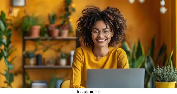 Smiling businesswoman sitting at desk in home office