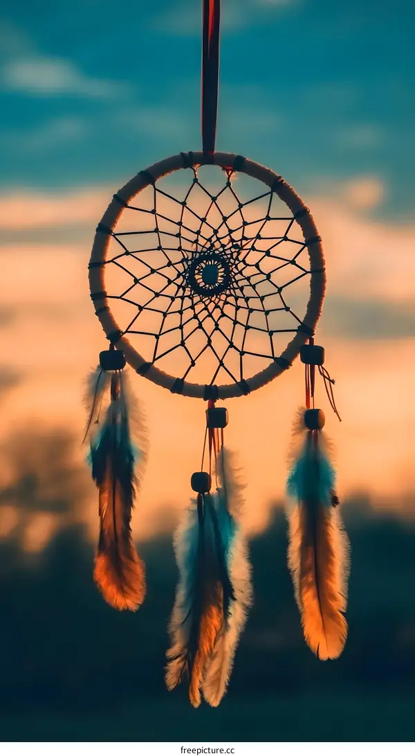 Dreamcatcher Hanging Against a Sunset Sky