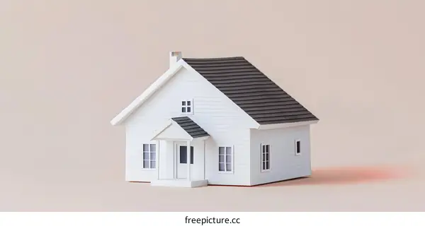 White Miniature House on Pink Background