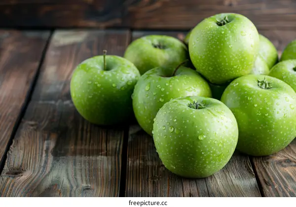 Fresh Green Apples on a Wooden Table