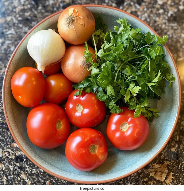 A bowl of tomatoes, onions, and parsley