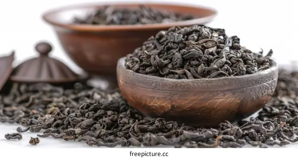 Black Tea Piled in a Wooden Bowl on a Table