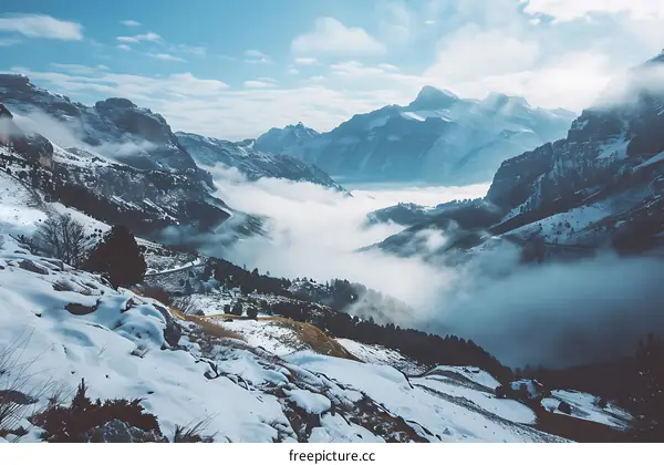 Snowy Mountain Landscape with Fog and Clouds