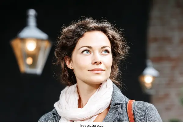 Woman Outdoors with Street Lamps