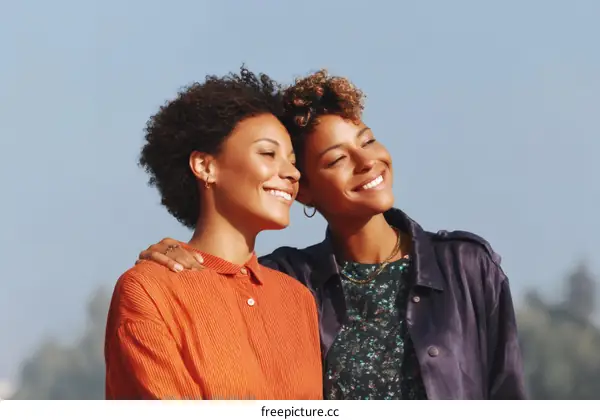 Two African American Women Smiling Outdoors