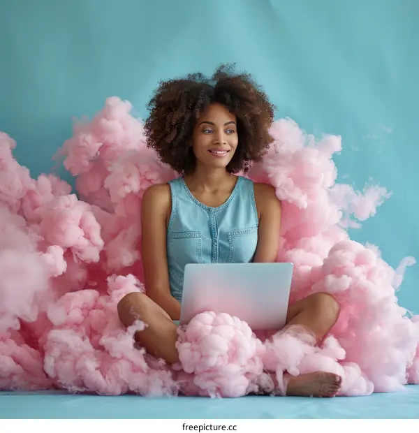 Young African American woman sitting on a cloud using a laptop