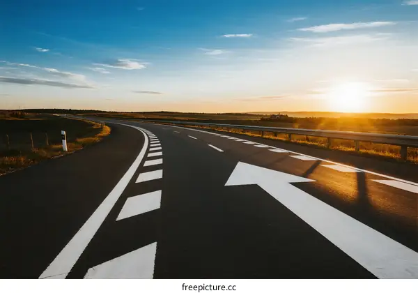 Sunset view of an empty highway with clear road markings