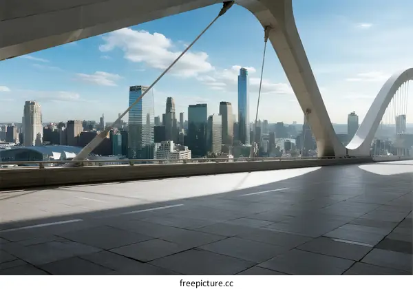 Modern city skyline with bridge structure under clear blue sky