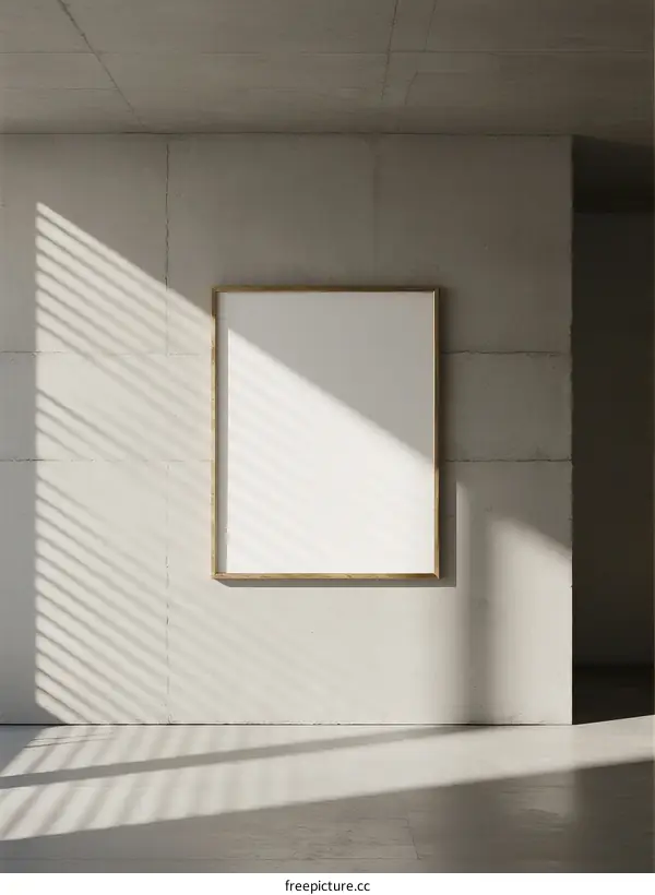 Minimalist white frame on concrete wall with sunlight shadows