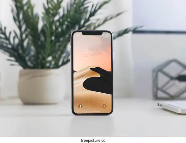 Golden iPhone with Desert Landscape Wallpaper