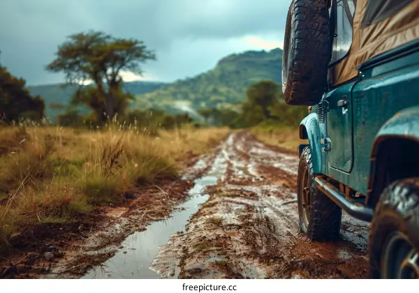 Off-road vehicle driving on a muddy road in a rural area