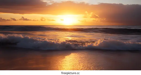 Sunrise Over the Ocean with Foamy Waves on the Beach