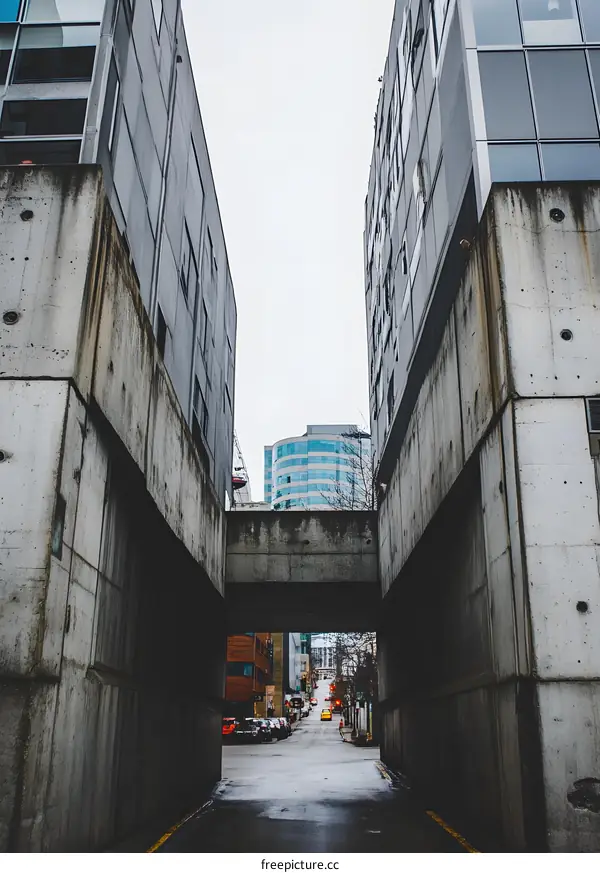 Concrete Alleyway with City Buildings in the Background